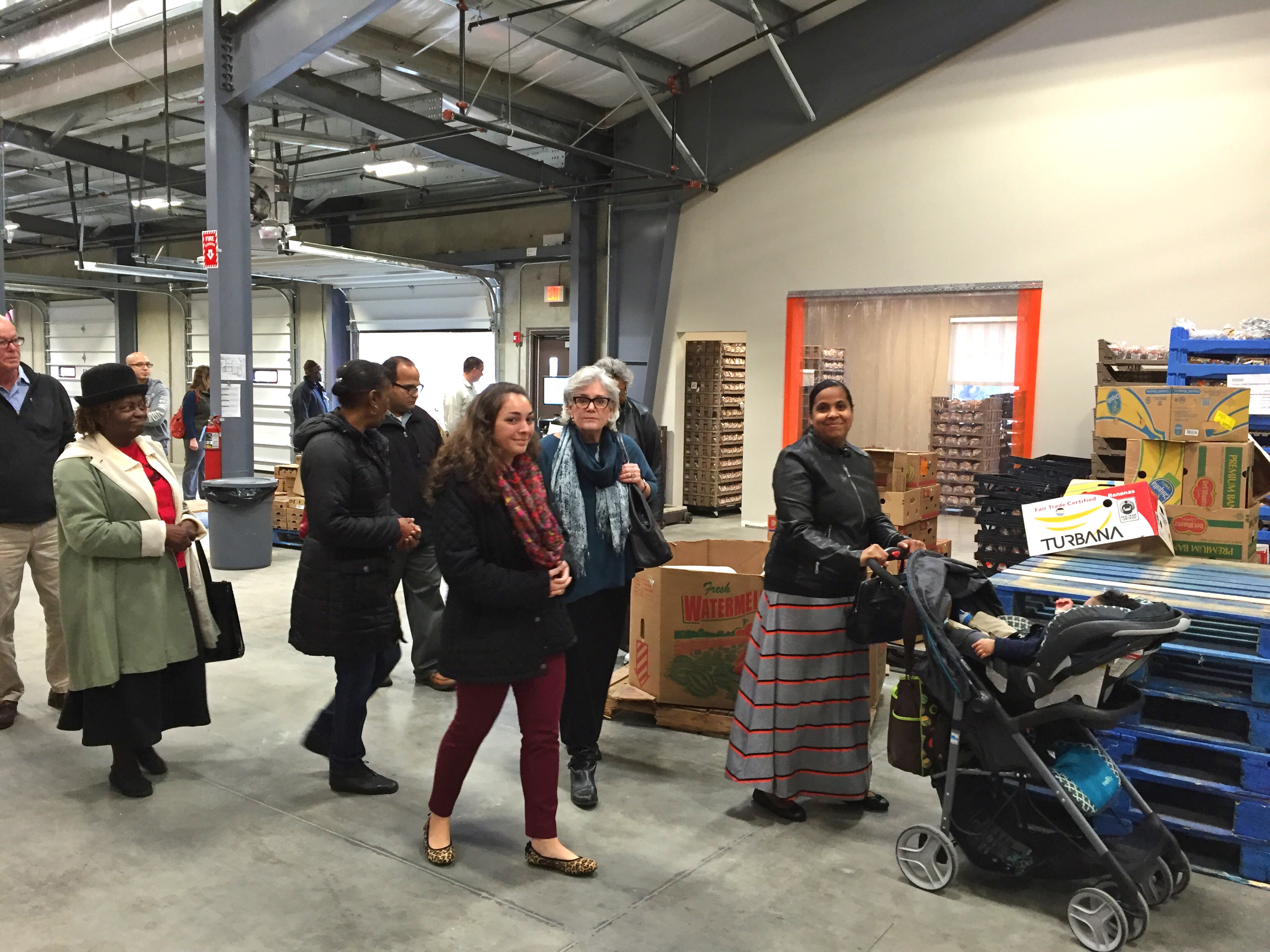 Member programs touring the main warehouse space in our new Wallingford distribution center. Note the future community leader in the stroller at right!